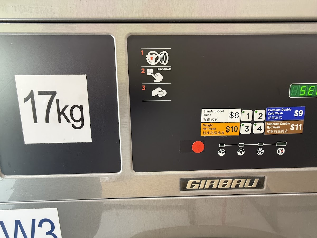 17kg Girbau washer control panel showing the four wash programs and prices