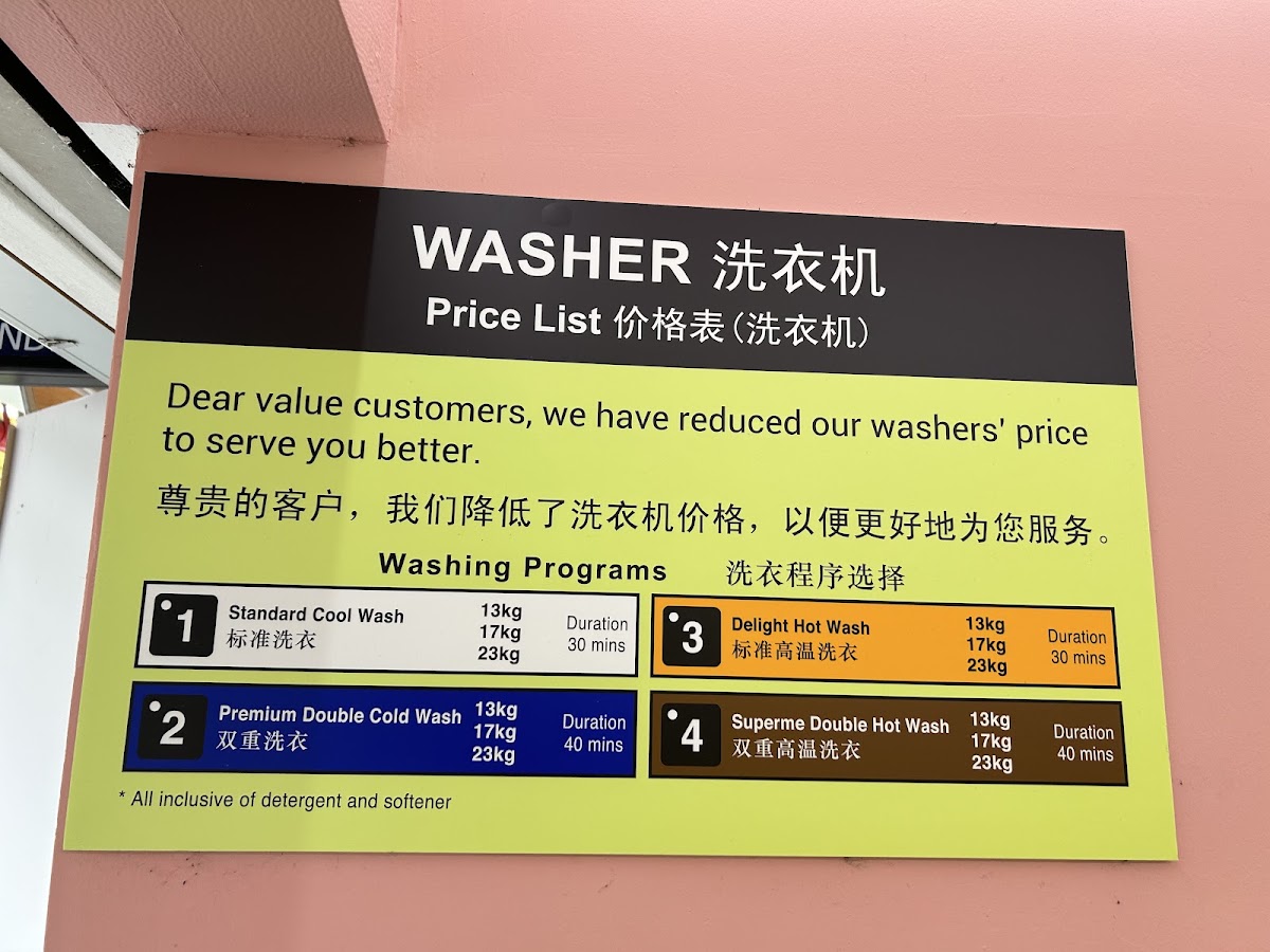 The washer price list board posted on the laundromat wall